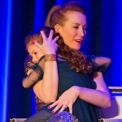 Tamara Rose hugging her daughter Ceci on stage